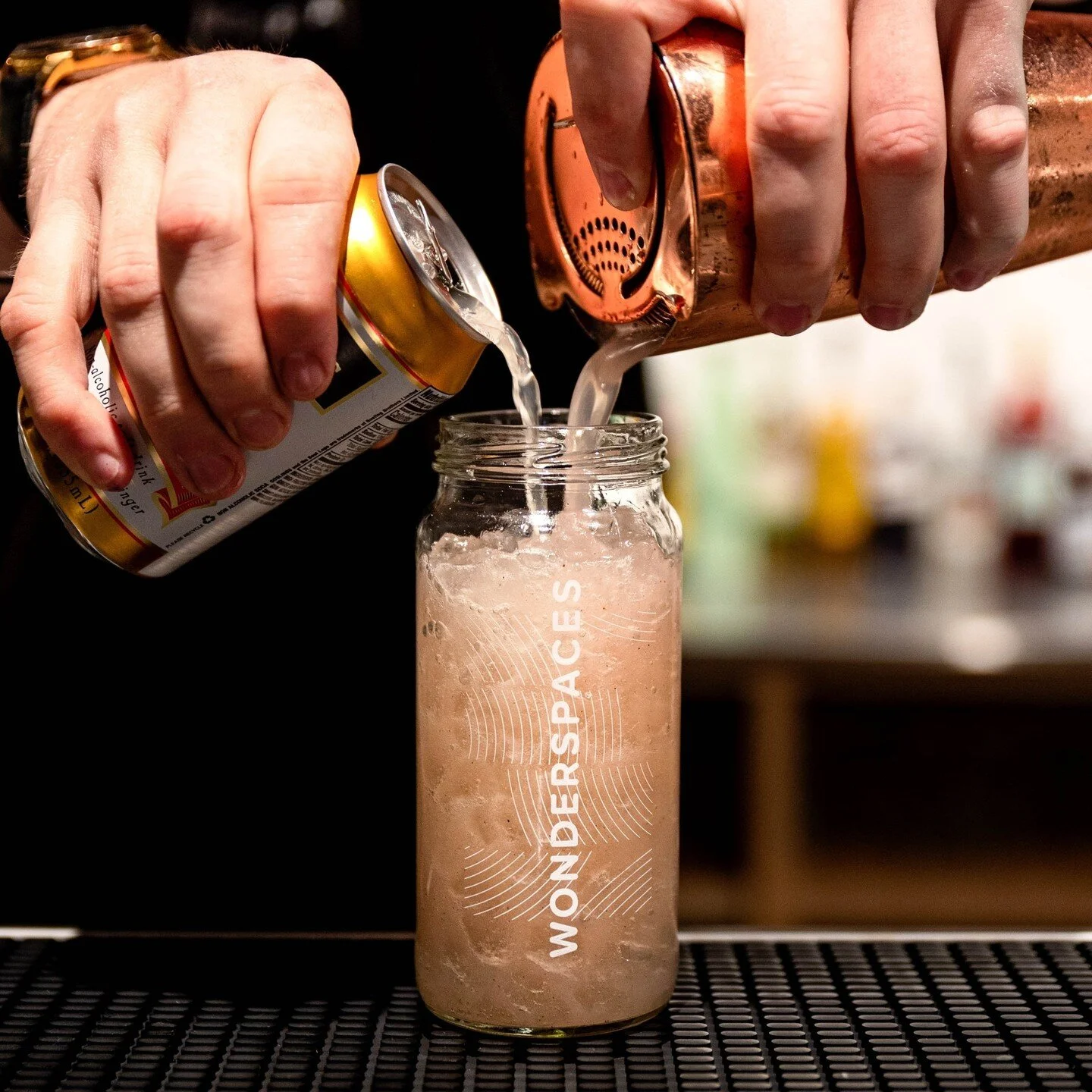 Colorful craft cocktails served in souvenir jars at the Wonderspaces bar