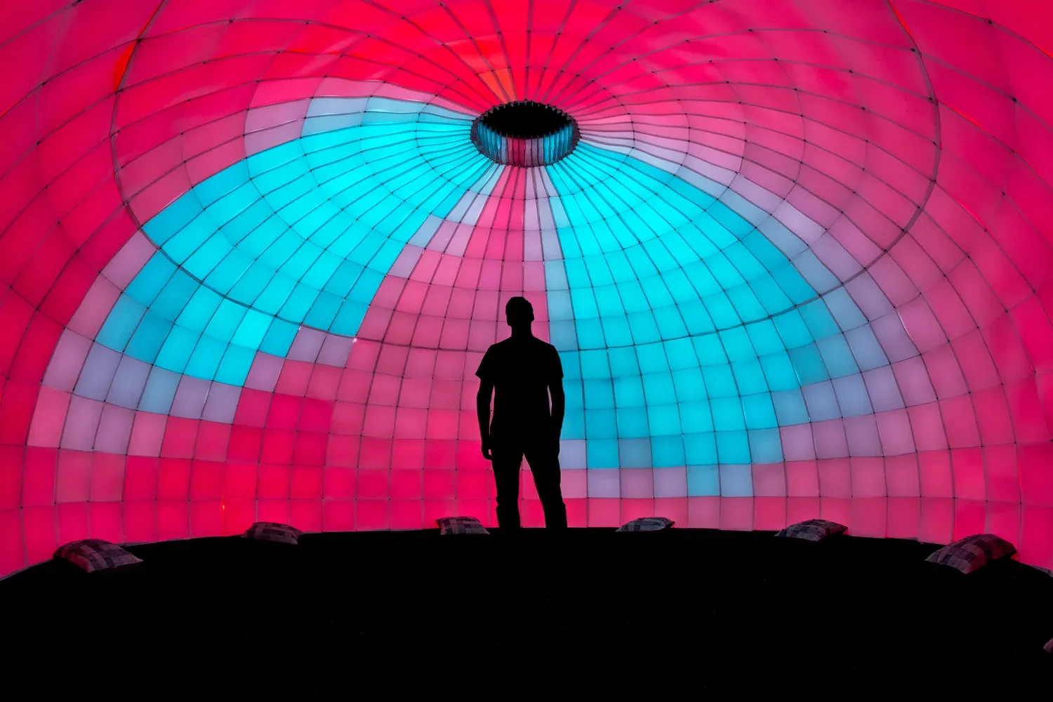 Visitors inside Plume, an immersive dome of synchronized light and sound