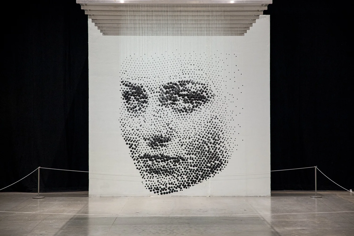 The Immigrant — 3D halftone sculpture of 2,300 wooden balls