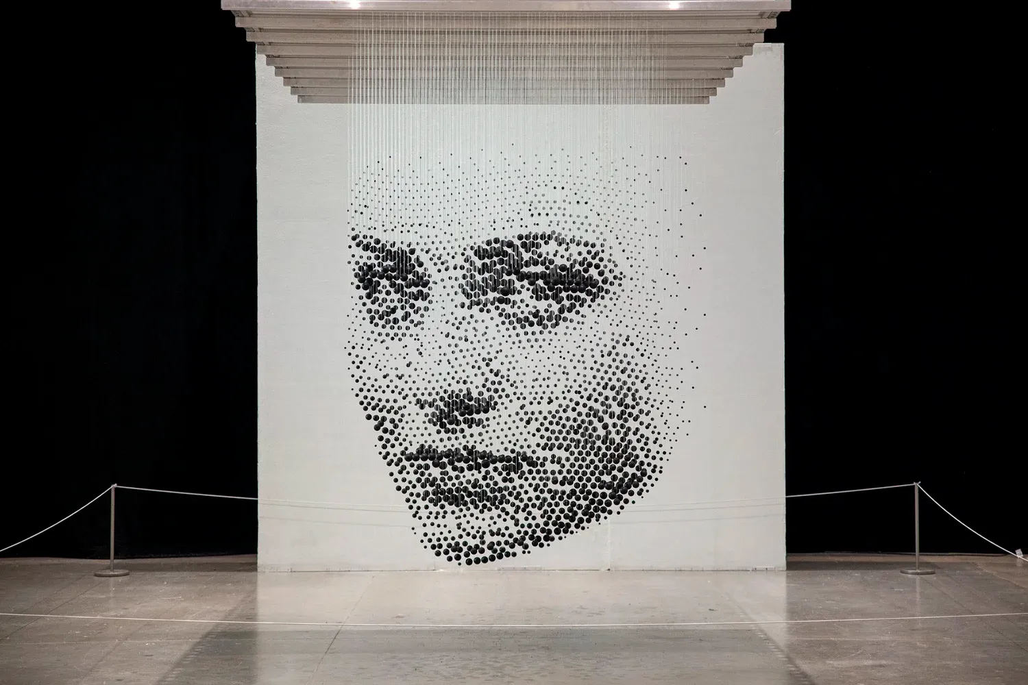 The Immigrant — 3D halftone sculpture of 2,300 wooden balls